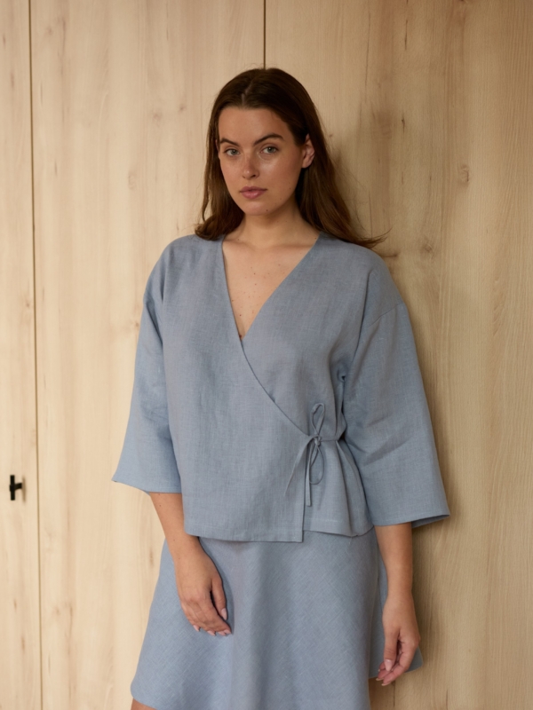 Image 1 of SOFIA linen kimono wrap top in Vista Blue, featuring a side tie closure and wide 3/4 sleeves, from ALBERALKIRK.